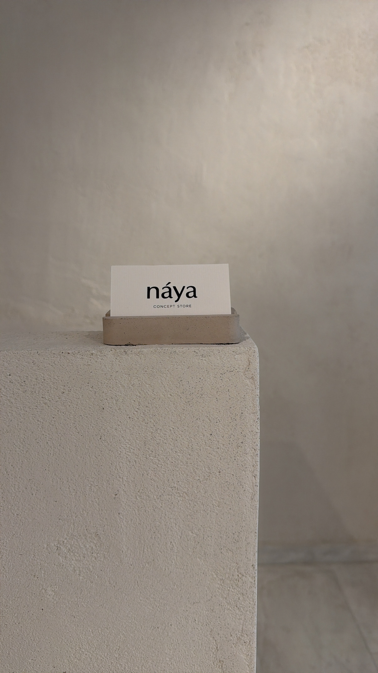 náya business card on concrete